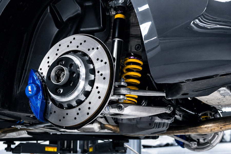 KW yellow height adjustable spring installed on a lowered BMW M car with M compound brakes